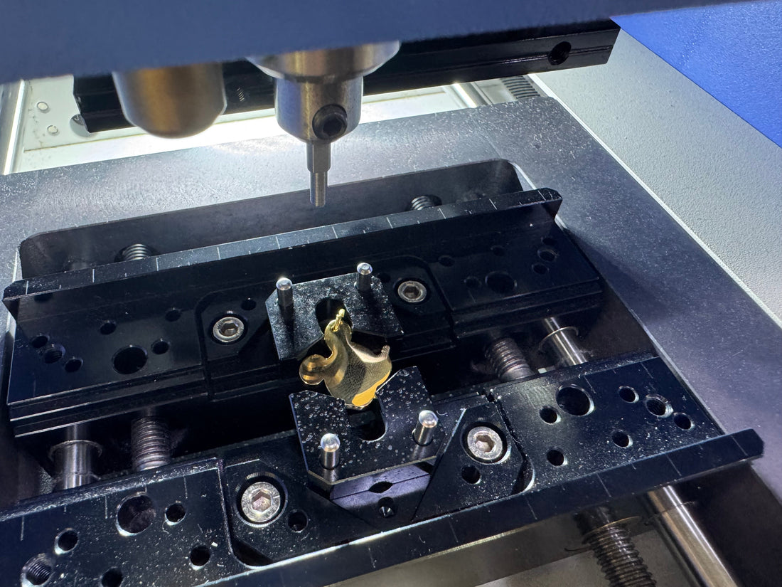 Mini Loop Adapter holding a pendant with loop securely positioned for engraving.